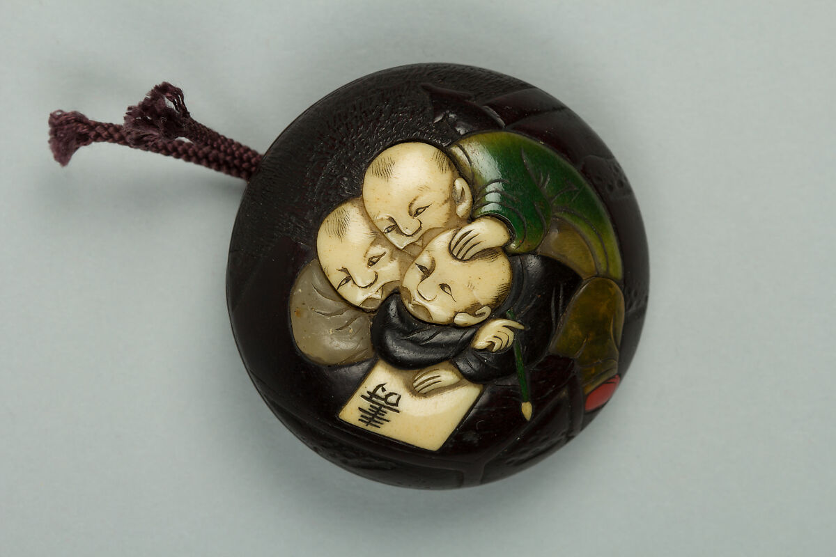 Netsuke, Wood inlaid with ivory, Japan 