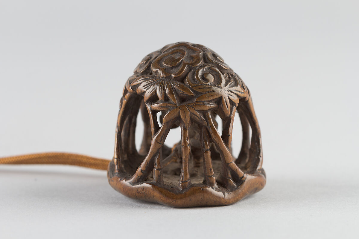 Netsuke of man in a bamboo grove, Carved wood, Japan