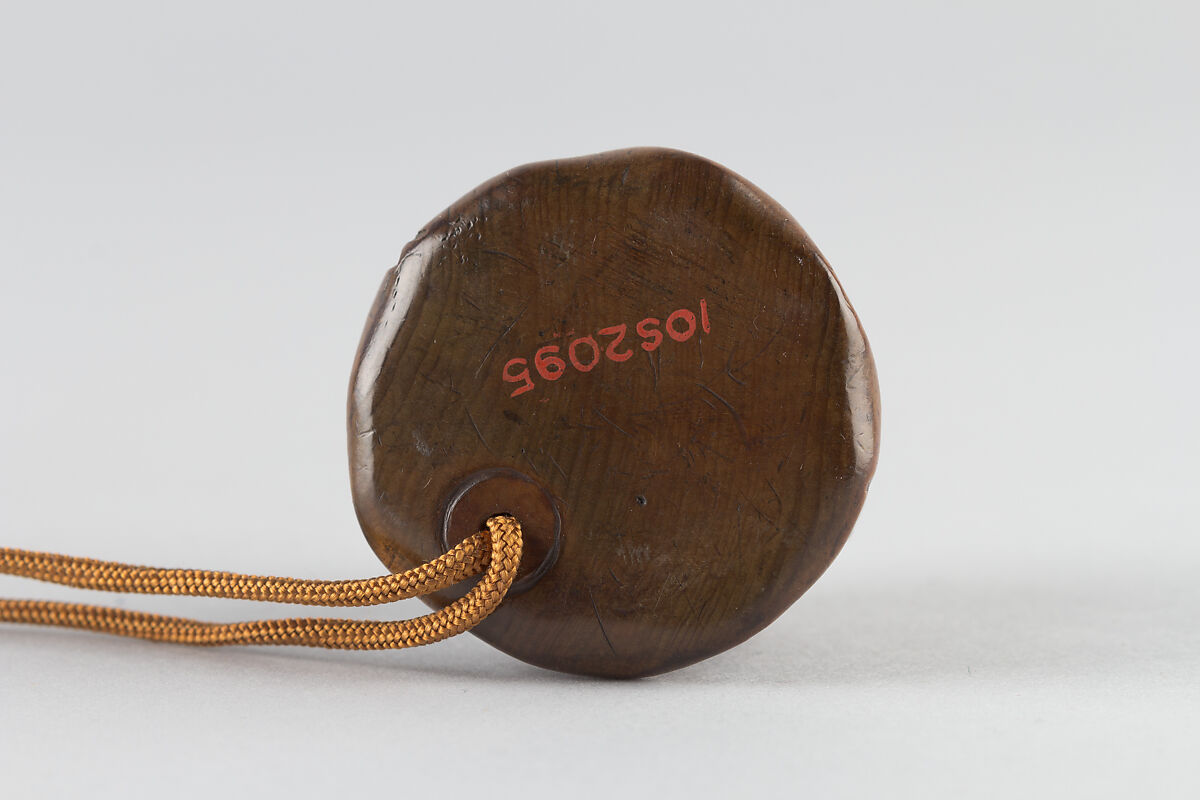 Netsuke of man in a bamboo grove, Carved wood, Japan