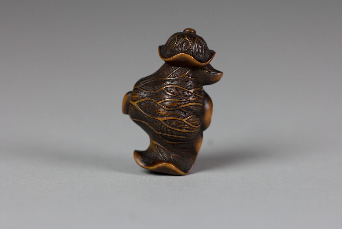 Tanuki in a Lotus Leaf, Matsuda Sukenaga (Japanese, 1800–1871), Wood, Japan