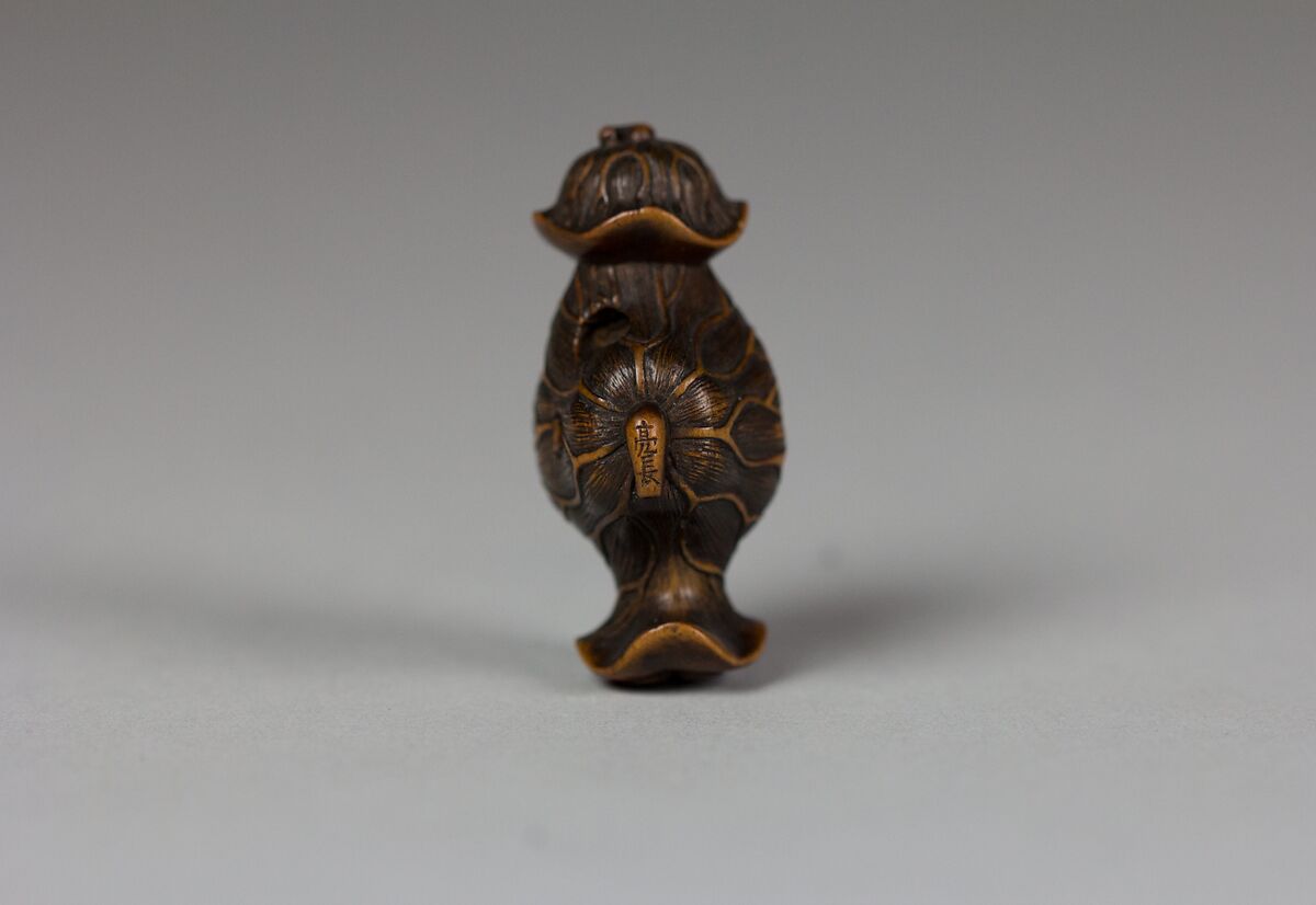 Tanuki in a Lotus Leaf, Matsuda Sukenaga (Japanese, 1800–1871), Wood, Japan