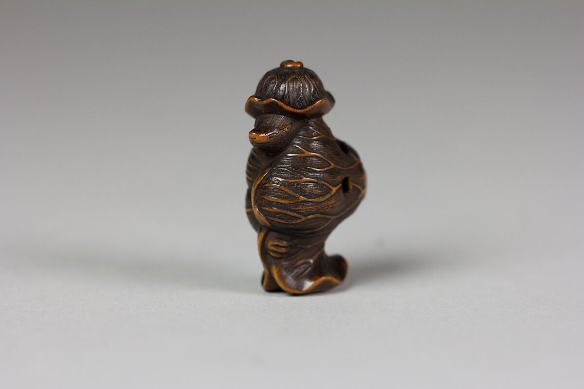 Tanuki in a Lotus Leaf, Matsuda Sukenaga (Japanese, 1800–1871), Wood, Japan 