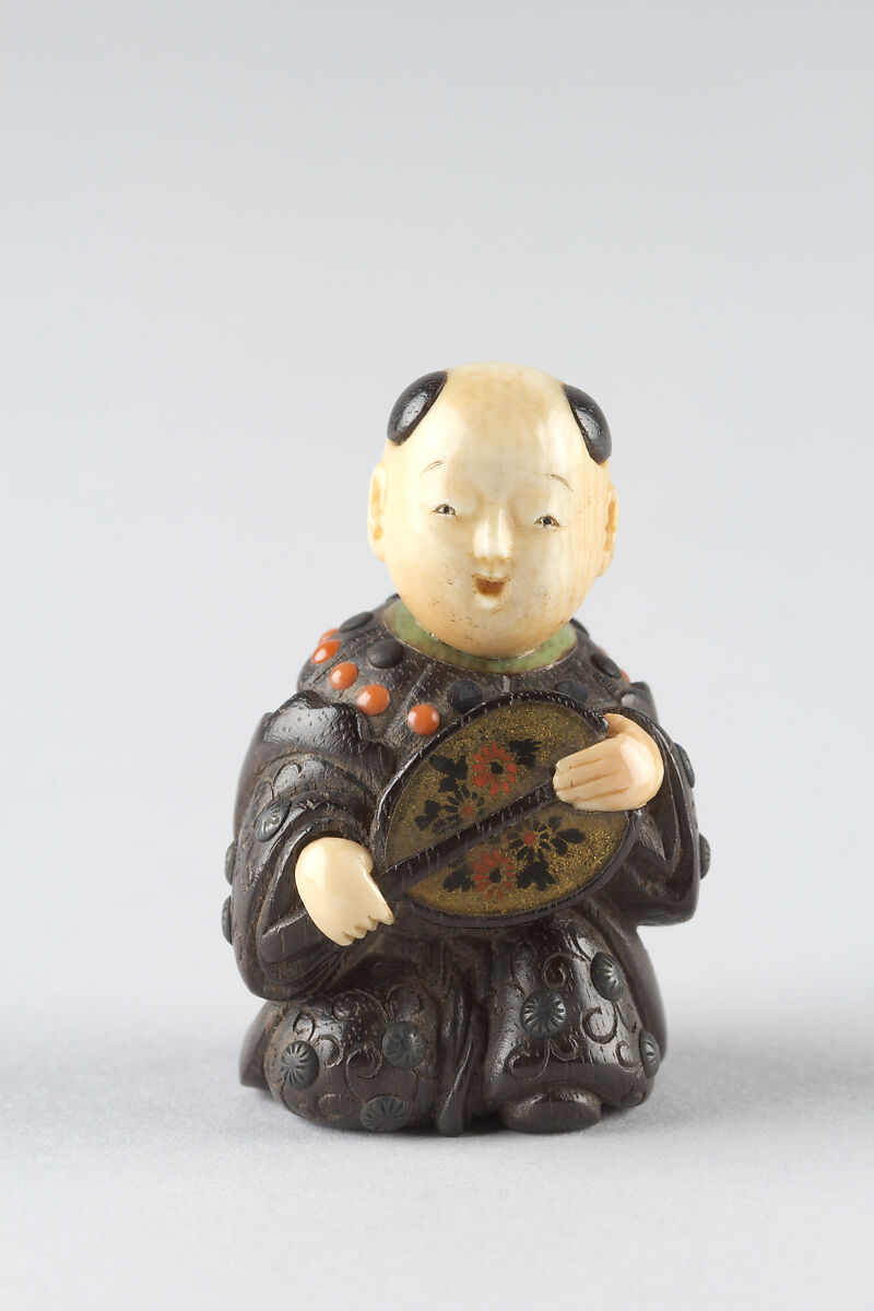 Netsuke of Boy with a Fan, Wood and ivory, Japan 