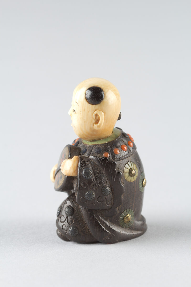 Netsuke of Boy with a Fan, Wood and ivory, Japan