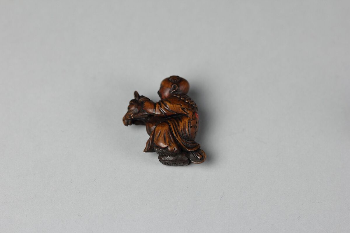 Netsuke of Boy Riding a Hobby Horse, Wood, Japan 