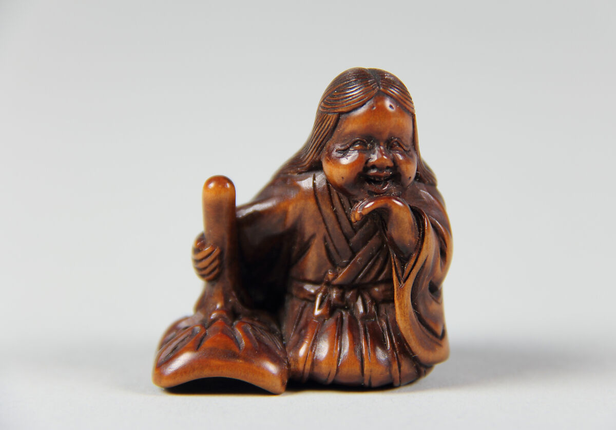 Netsuke of Girl with a Mask, Wood, Japan 