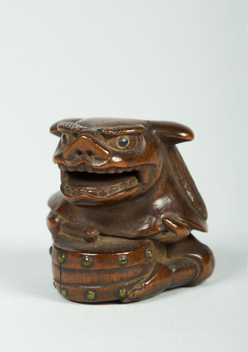 Netsuke of Man Wearing a Mask and Beating a Drum, Wood, Japan 
