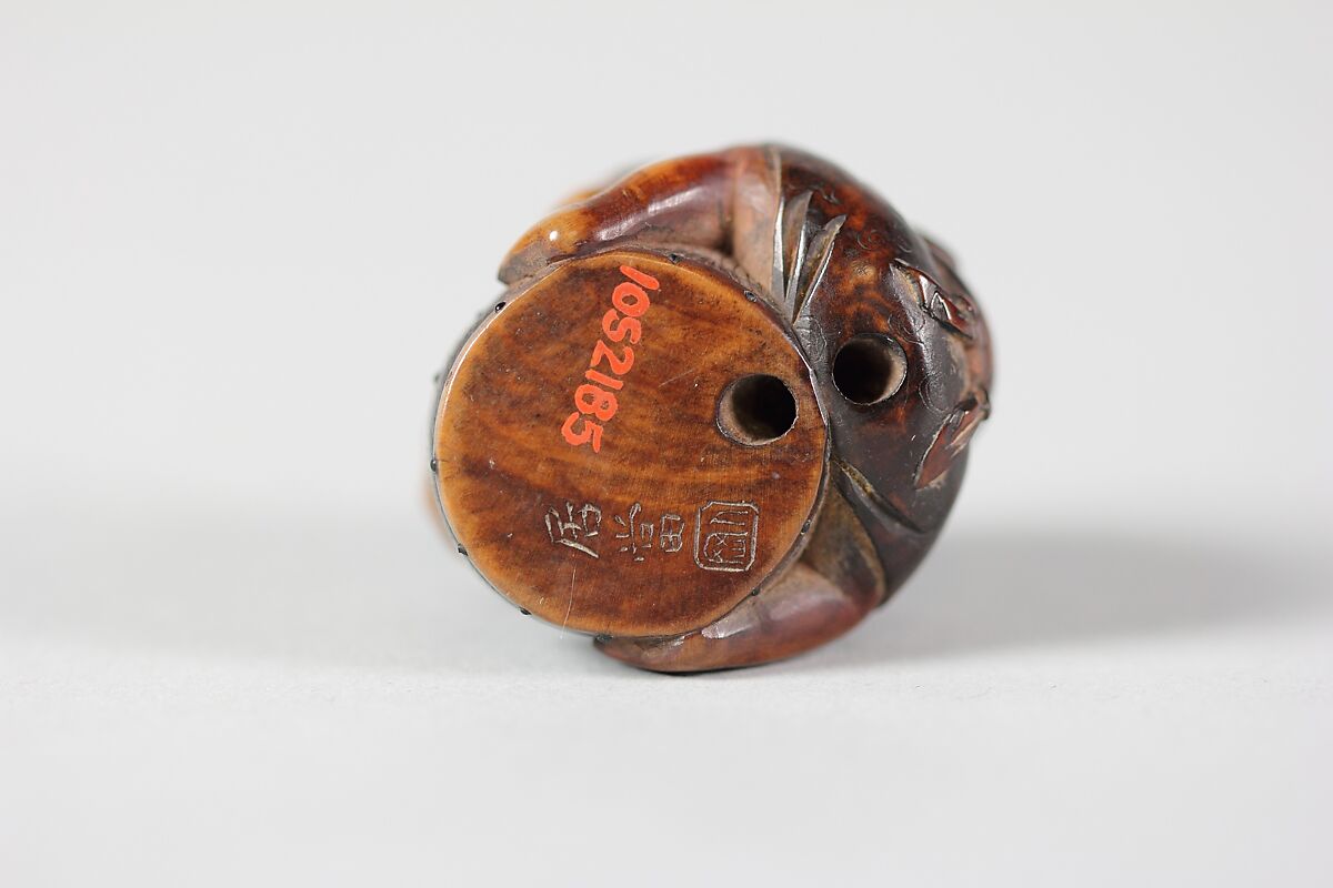 Netsuke of Masked Figure with a Drum, Wood, Japan