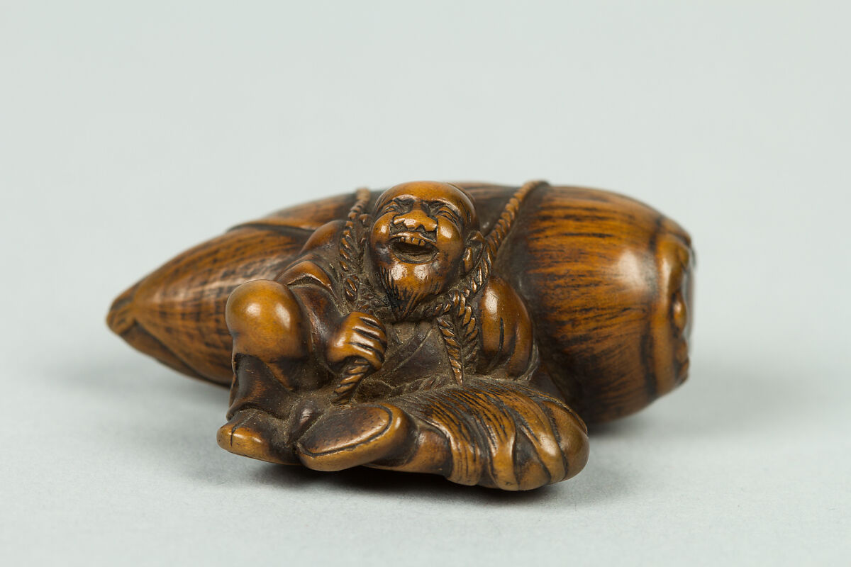 Netsuke of Old Man Carrying a Very Large Acorn, Wood, Japan 