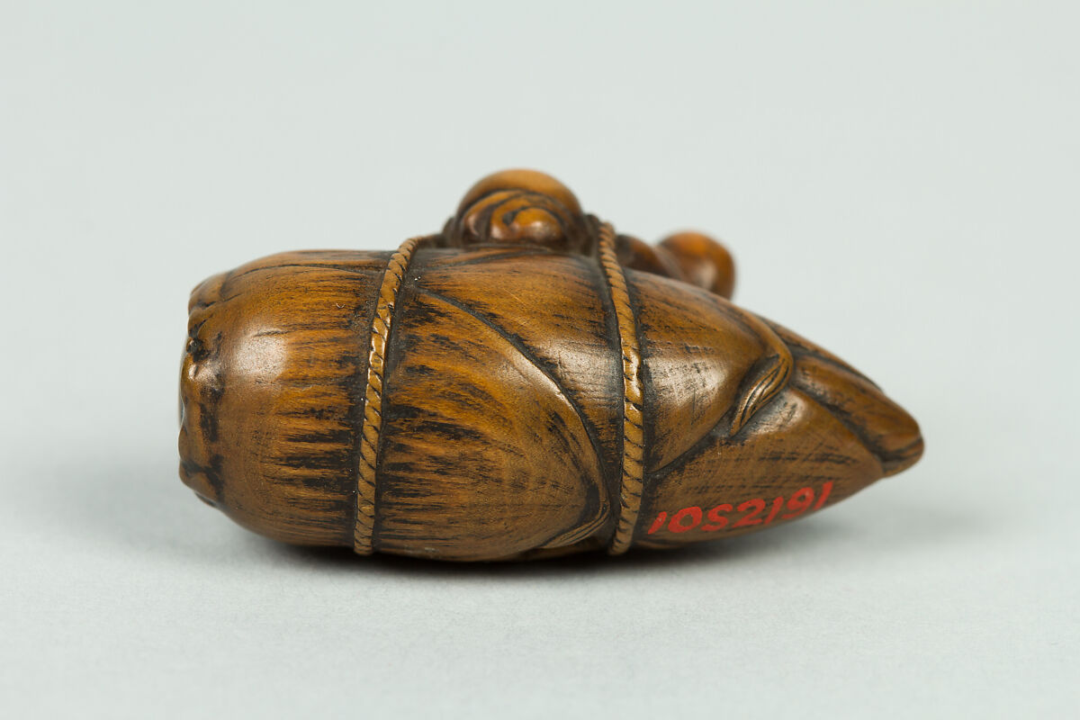 Netsuke of Old Man Carrying a Very Large Acorn, Wood, Japan