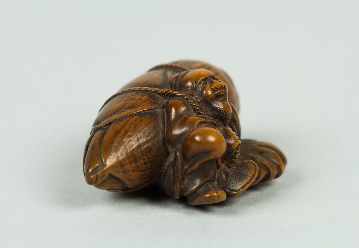 Netsuke of Old Man Carrying a Very Large Acorn, Wood, Japan