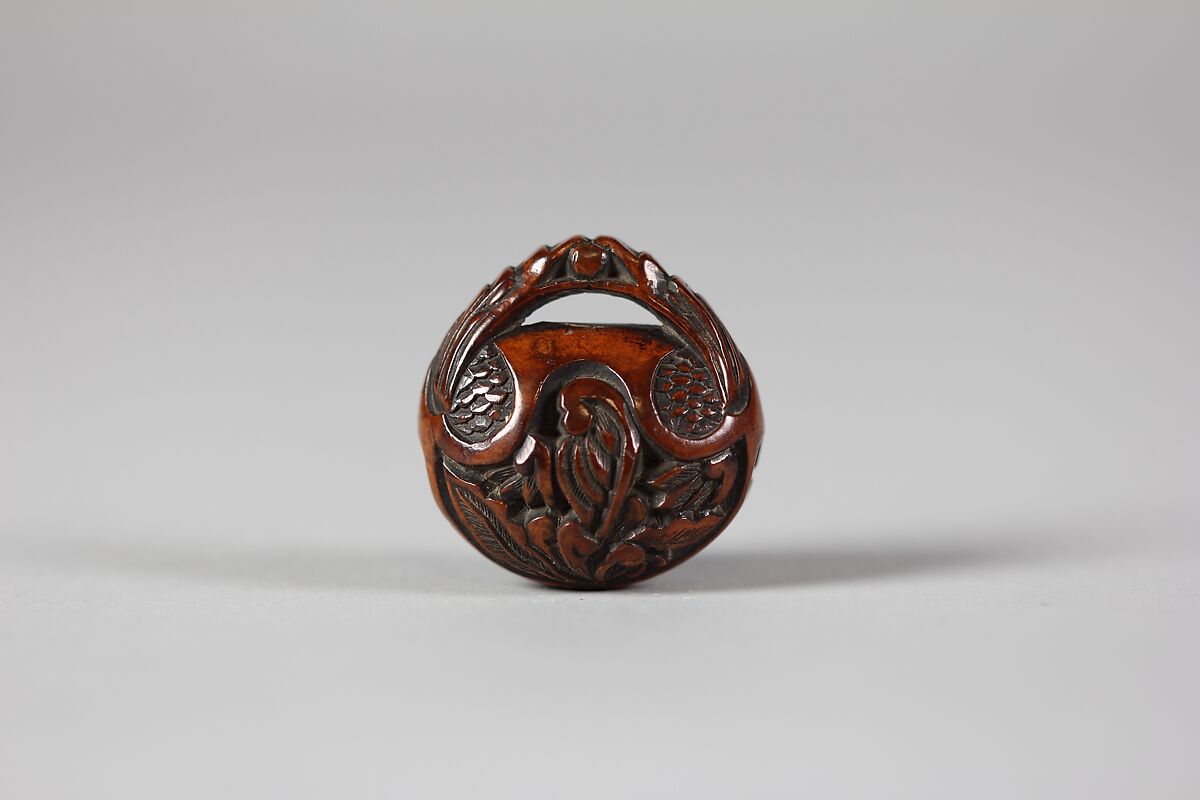 Netsuke in the form of a Nut Containing a Carved Landscape, Wood, Japan 