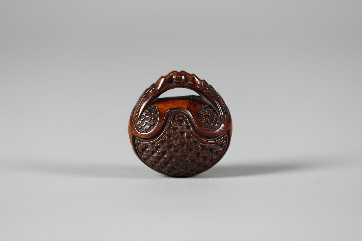 Netsuke in the form of a Nut Containing a Carved Landscape, Wood, Japan