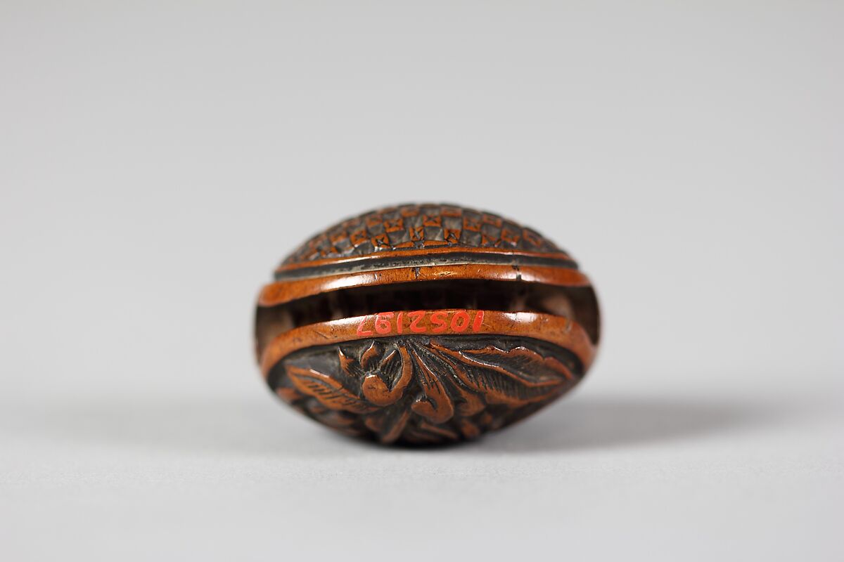 Netsuke in the form of a Nut Containing a Carved Landscape, Wood, Japan