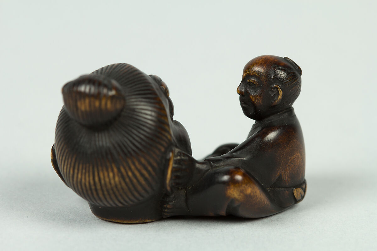 Netsuke of Sculptor Modelling a Large Head, Wood, Japan
