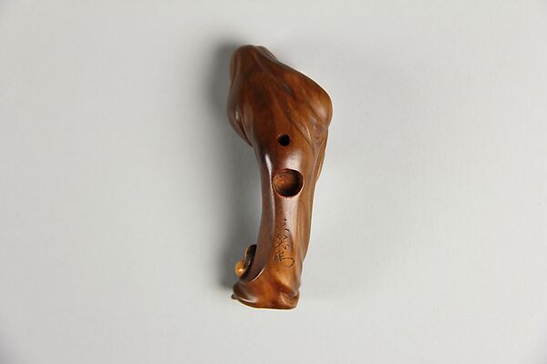 Netsuke of Daruma Tempted by Okami, Sanshō (1871–1936), Wood with ivory insert, Japan