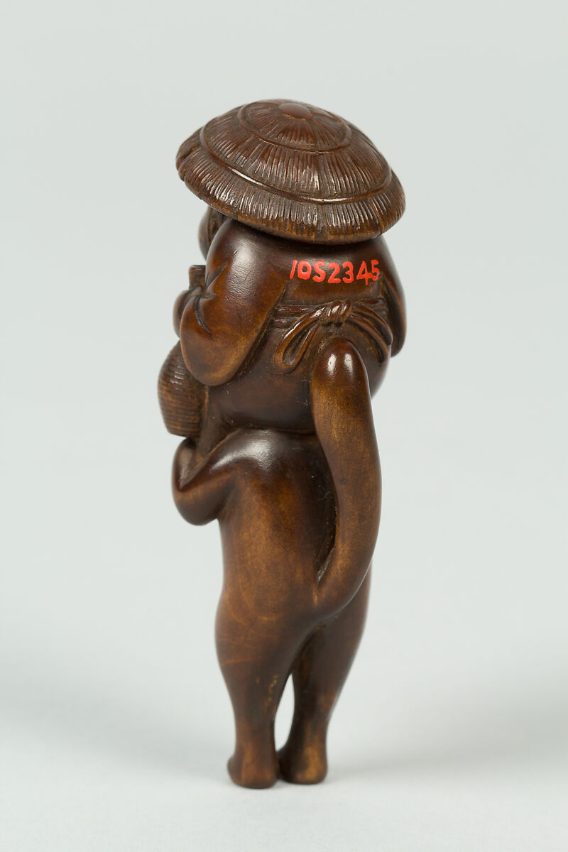 Netsuke of Boy Sitting on the Shoulders of an Animal, Wood; inlaid eyes, Japan