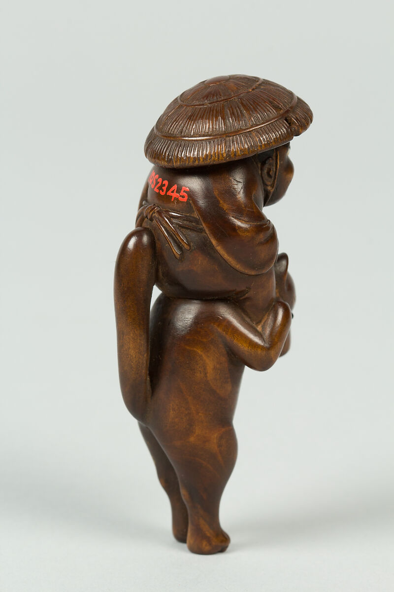 Netsuke of Boy Sitting on the Shoulders of an Animal, Wood; inlaid eyes, Japan