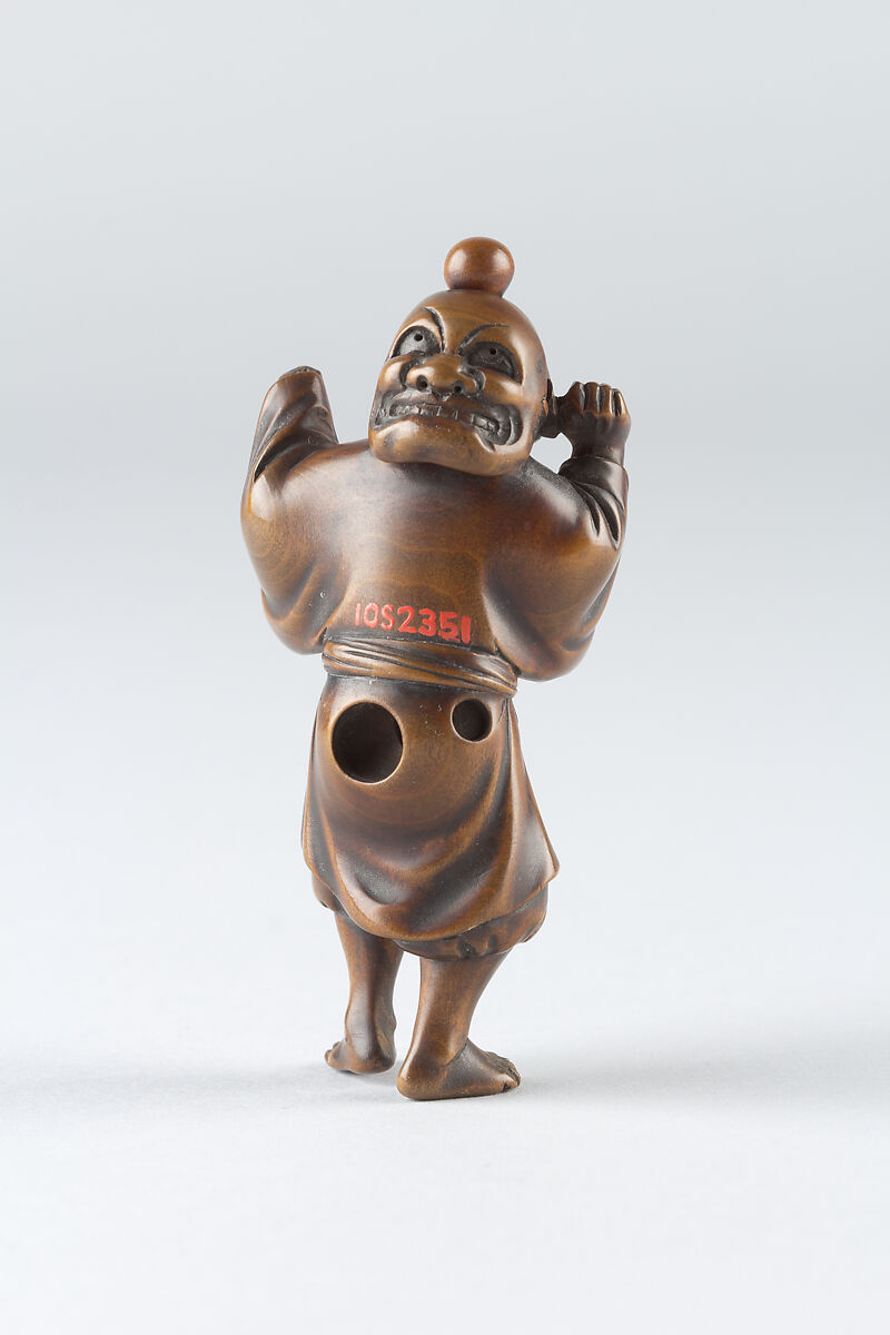 Netsuke of Boy Wearing a Mask, Wood, Japan