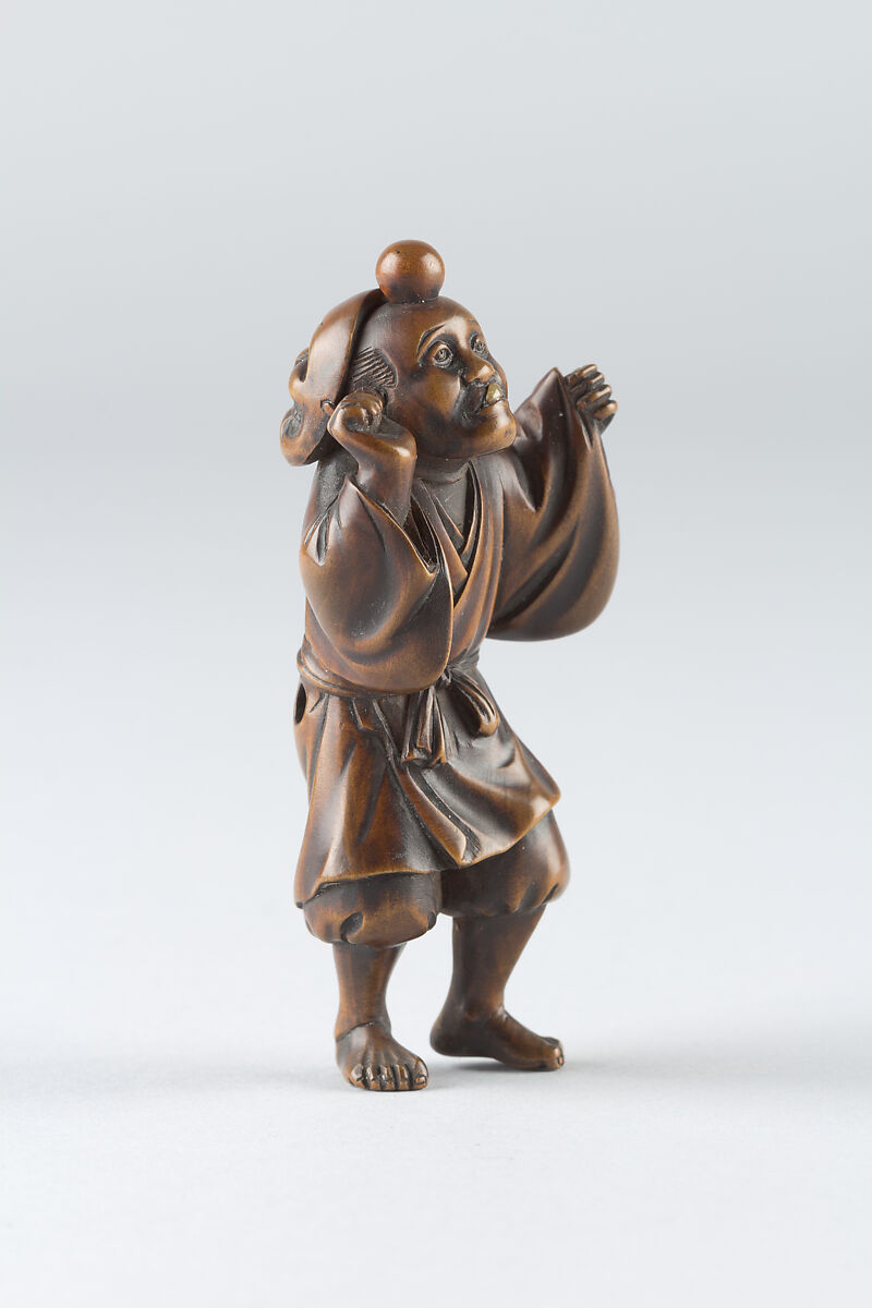 Netsuke of Boy Wearing a Mask, Wood, Japan