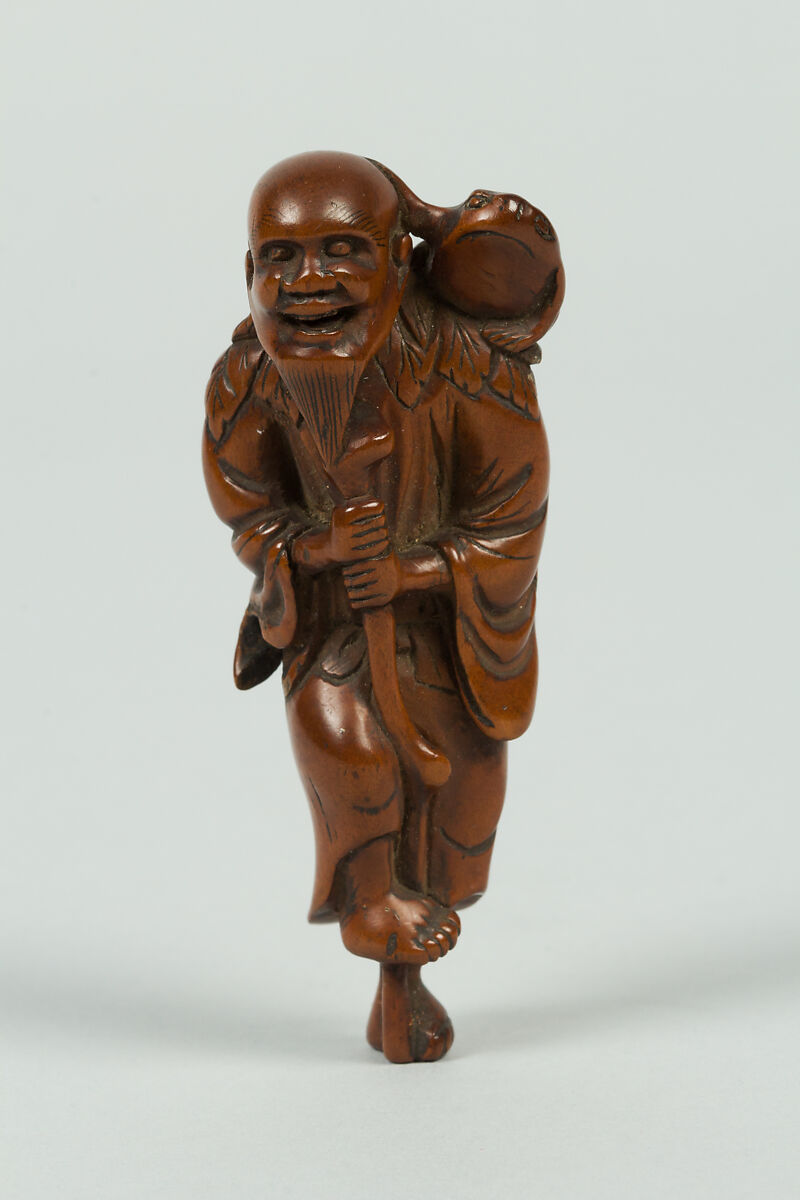 Netsuke of Old Man Leaning on a Stick; Frog on His Shoulder, Wood, Japan 