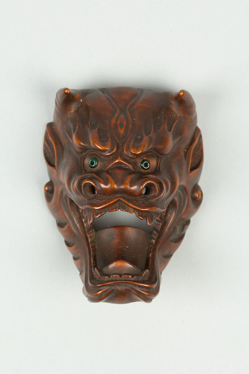 Netsuke of Devil Mask with Wide-Open Mouth, Wood, dark brown; inlaid green glass eyes, Japan 