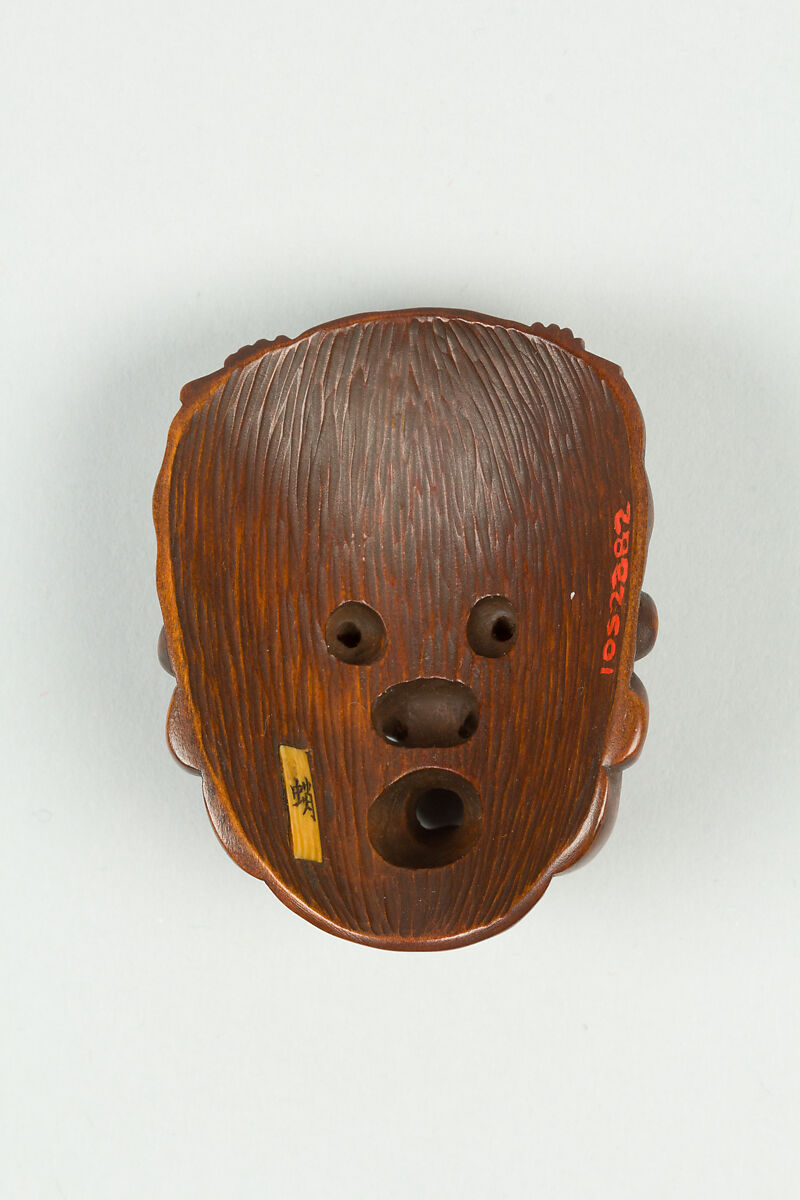 Netsuke of Mask, Wood, dark brown; inlaid eyes, Japan
