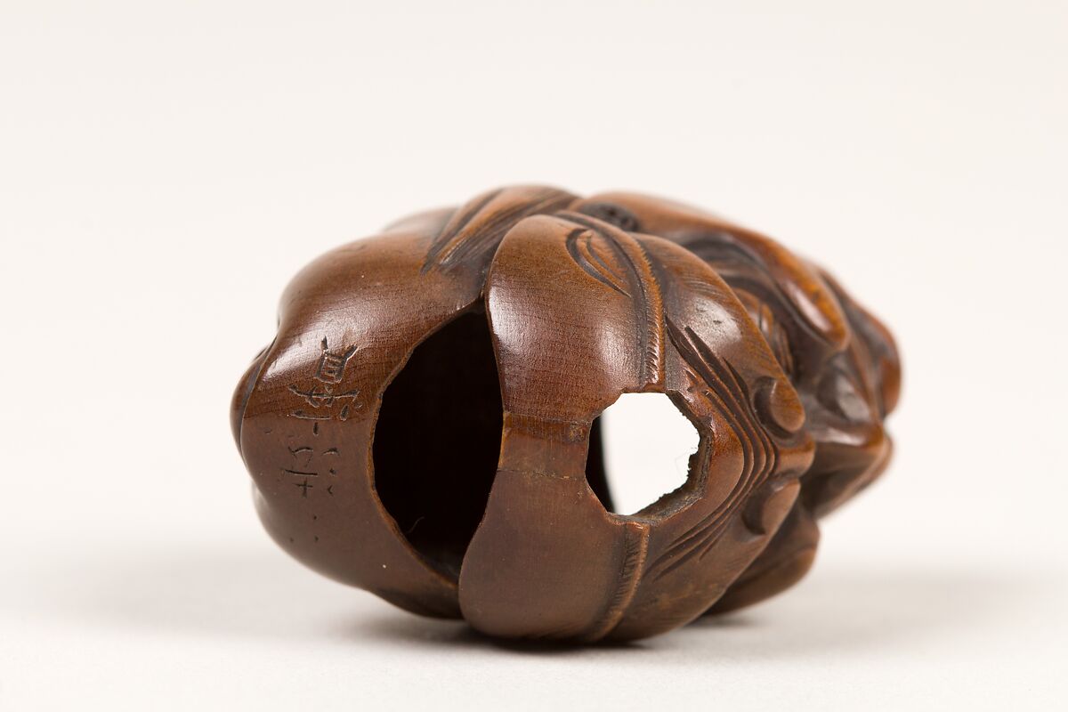 Netsuke of Double Mask, Wood-dark brown, Japan