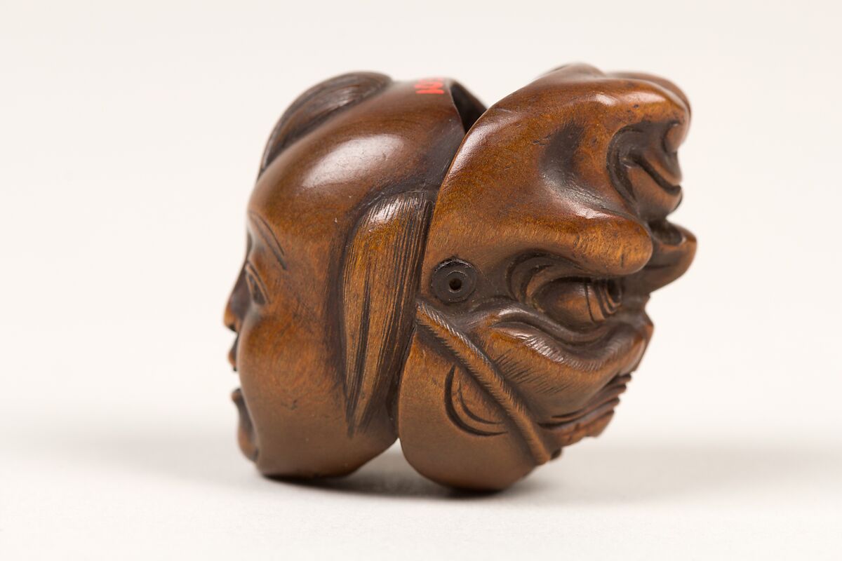 Netsuke of Double Mask, Wood-dark brown, Japan