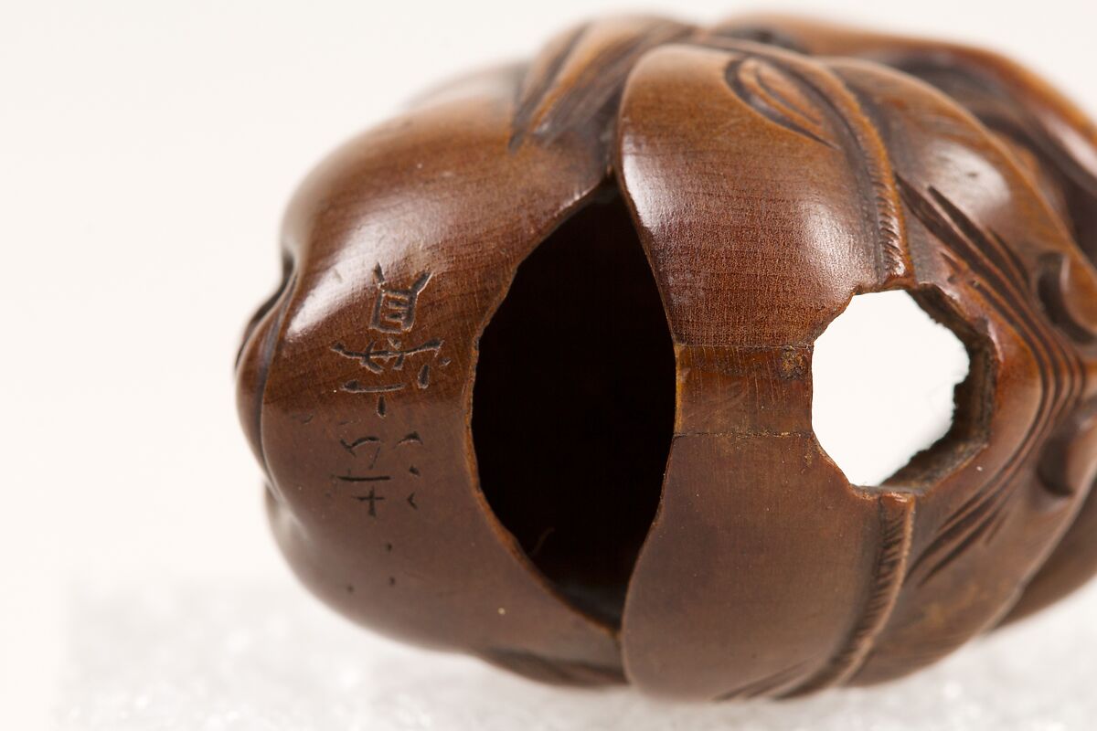 Netsuke of Double Mask, Wood-dark brown, Japan