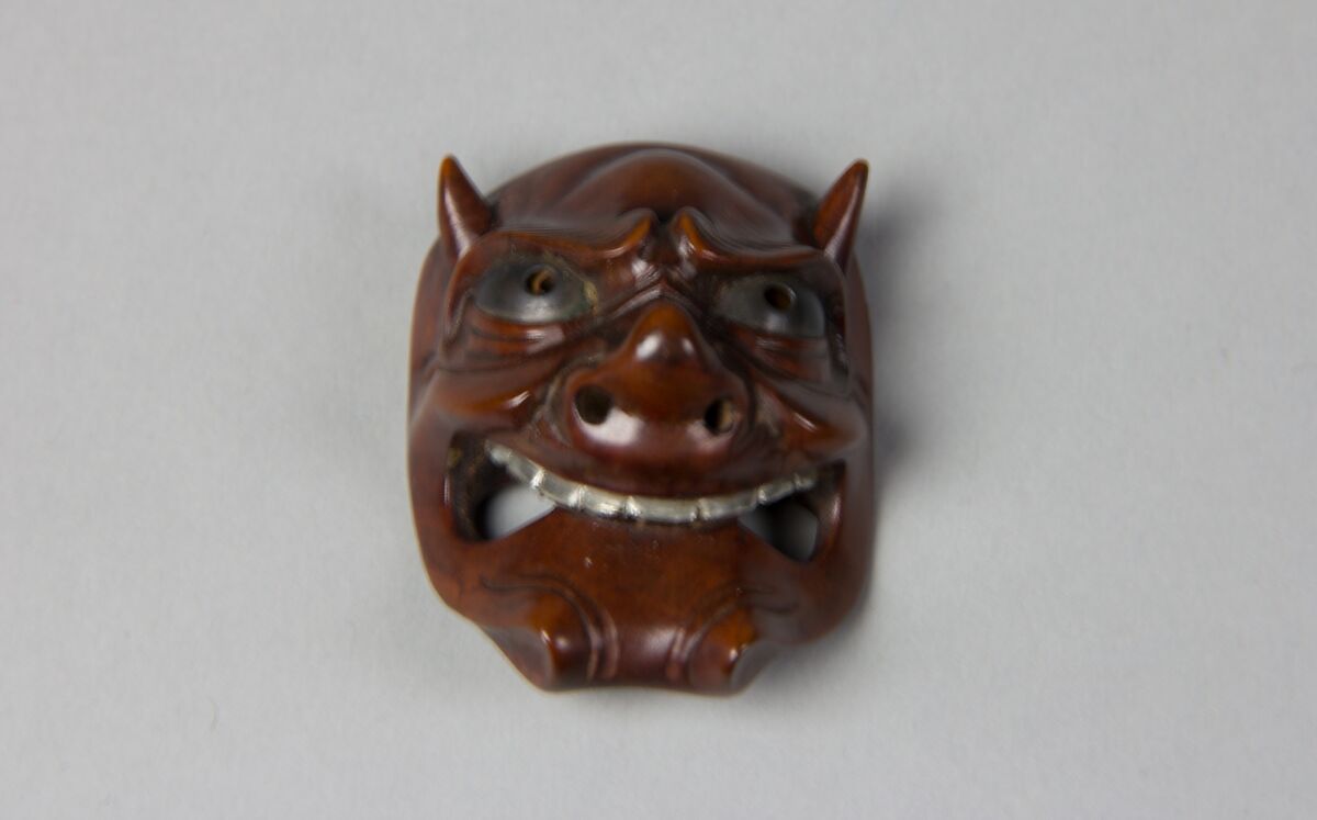 Netsuke of Noh Mask, Wood with metal eyes and teeth, Japan 