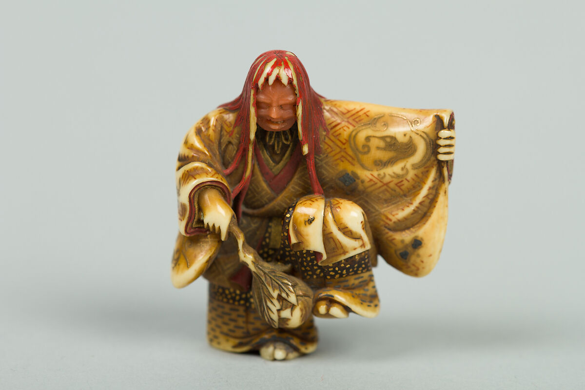 Netsuke of Noh Dancer with Long Red Hair and Peony, Ivory; decoration in gold and red lacquer; face of pink stone, Japan 