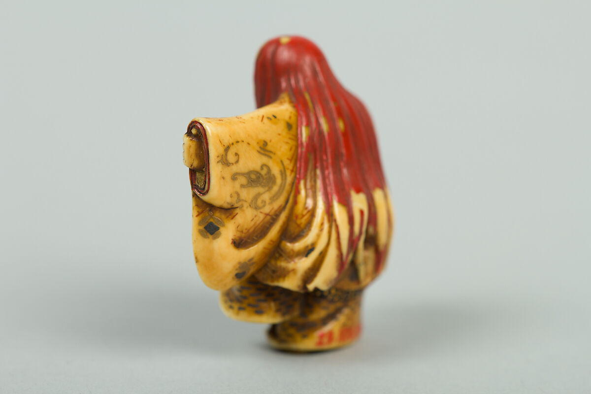 Netsuke of Noh Dancer with Long Red Hair and Peony, Ivory; decoration in gold and red lacquer; face of pink stone, Japan