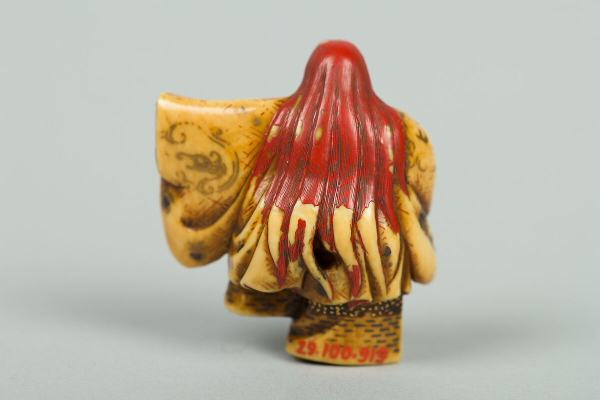 Netsuke of Noh Dancer with Long Red Hair and Peony, Ivory; decoration in gold and red lacquer; face of pink stone, Japan