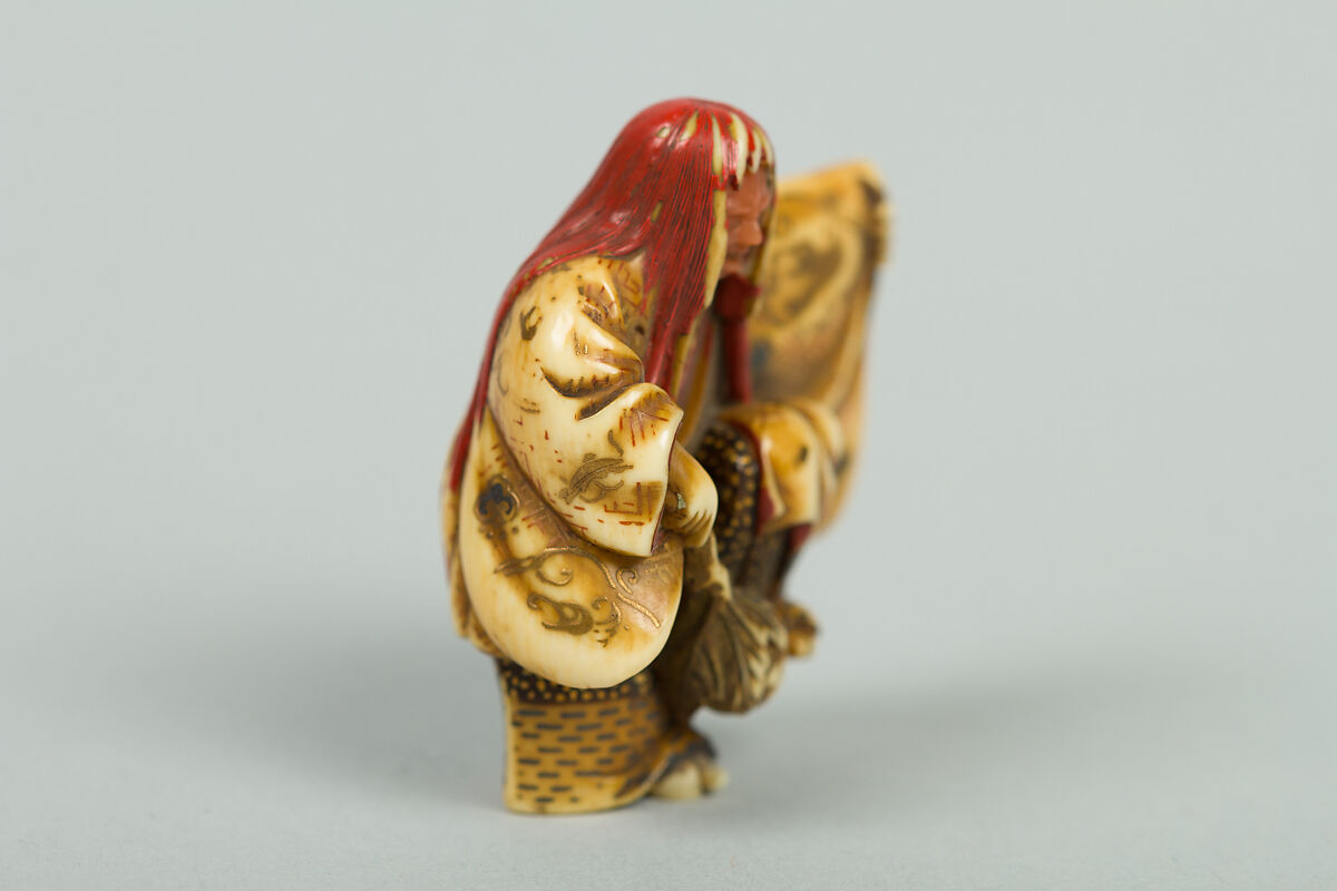 Netsuke of Noh Dancer with Long Red Hair and Peony, Ivory; decoration in gold and red lacquer; face of pink stone, Japan