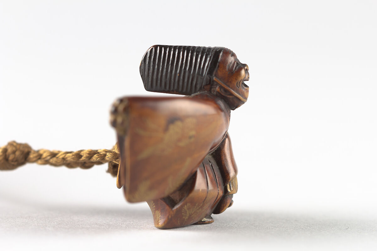 Netsuke of Sambaso Dancer with Bells and Fan, Lacquered wood, Japan