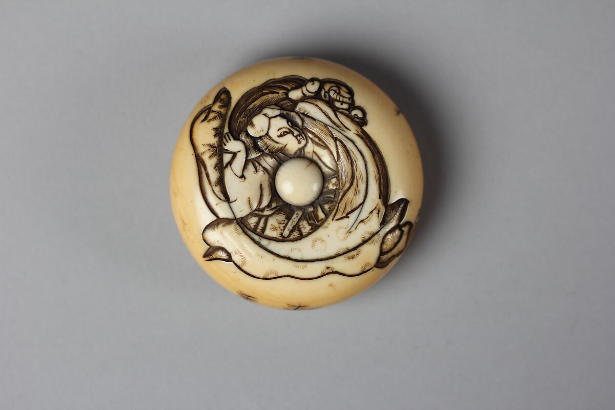 Netsuke of Woman with a Demon, Carved ivory, Japan 