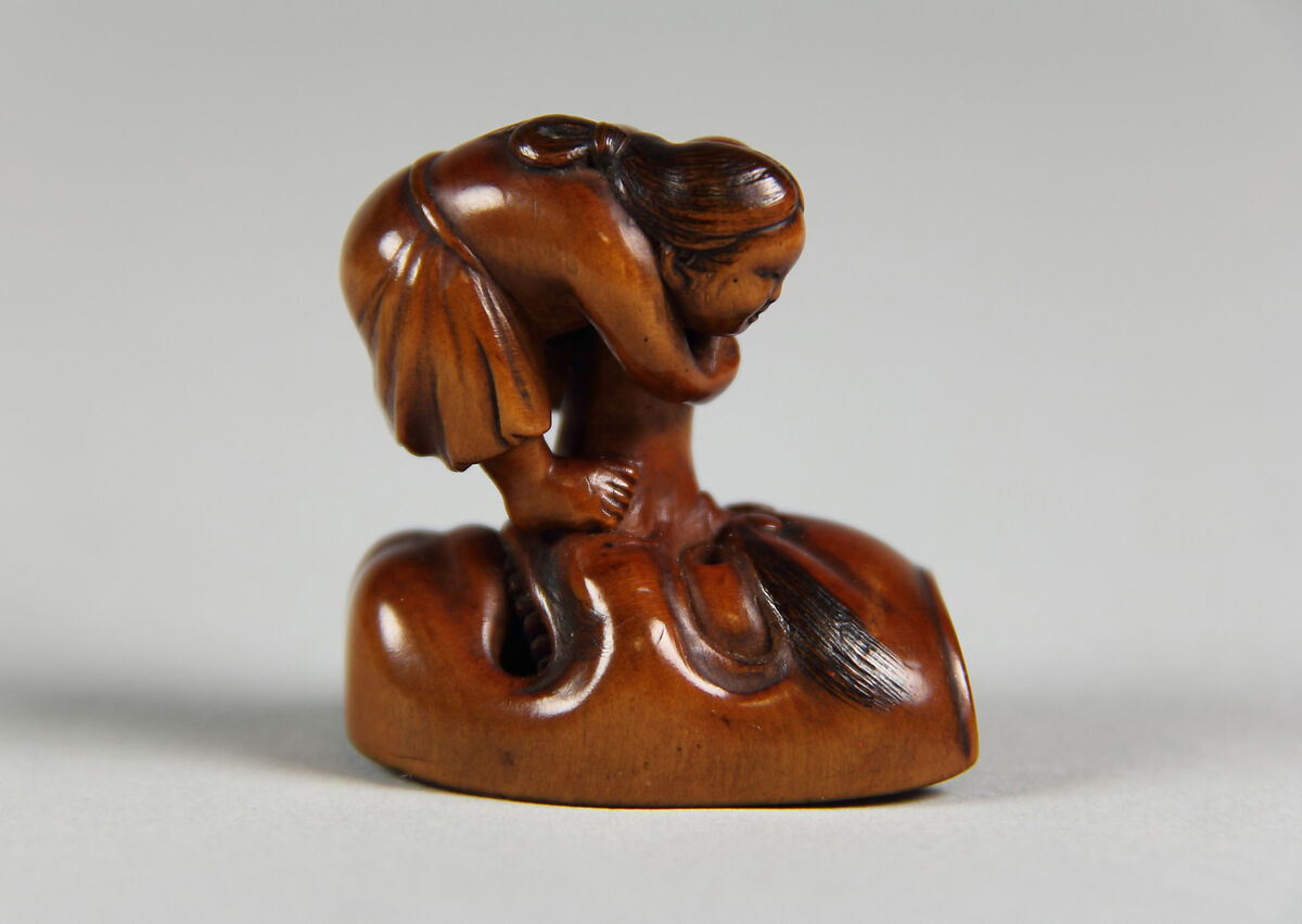 Netsuke of Mask; Uzume (Okame) and a Tengu mask, Wood, Japan 