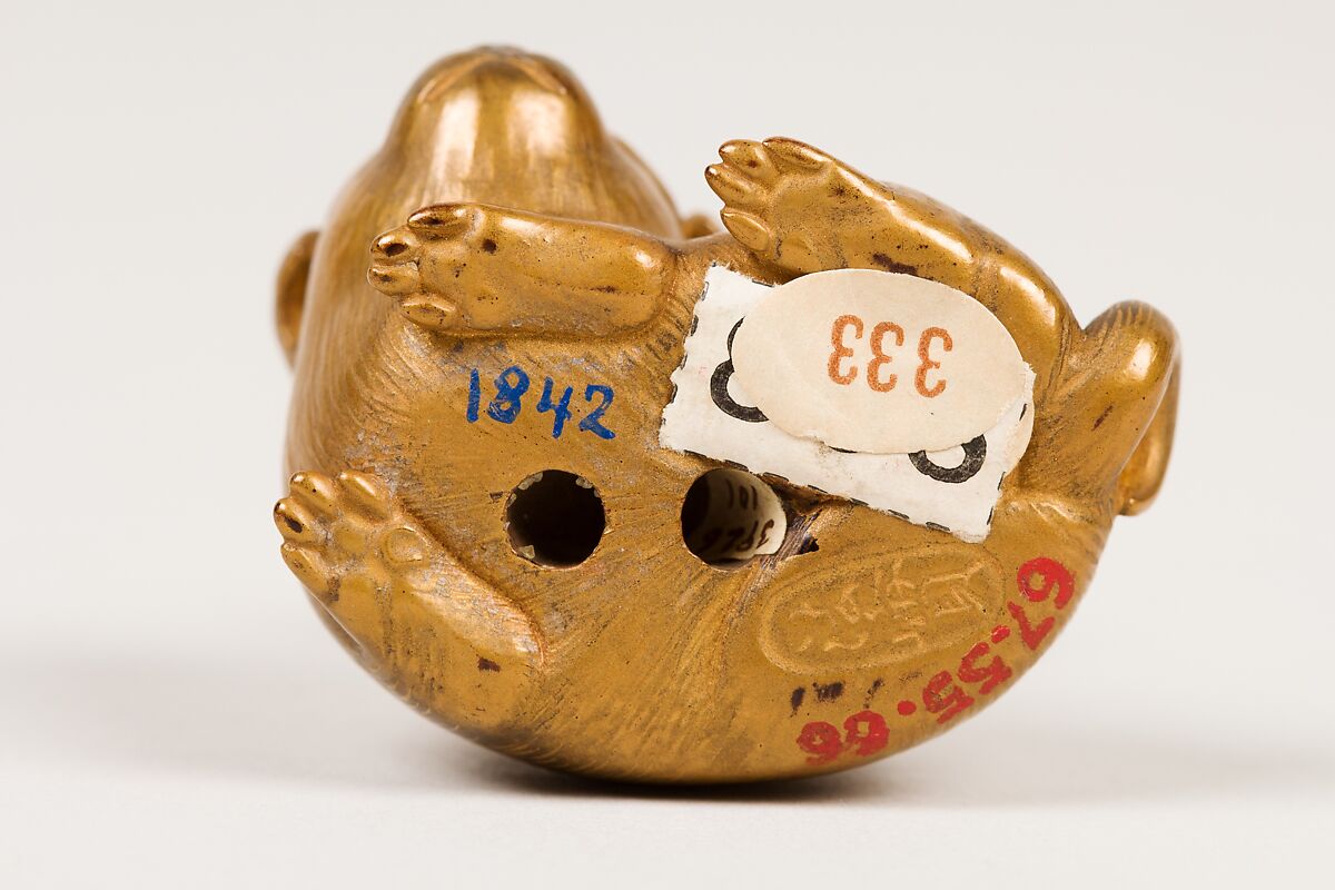 Netsuke of Seated Puppy with Short Curled Tail, Norizane (Japanese), Wood, gold lacquer mottled with black; black lacquer eyes, Japan