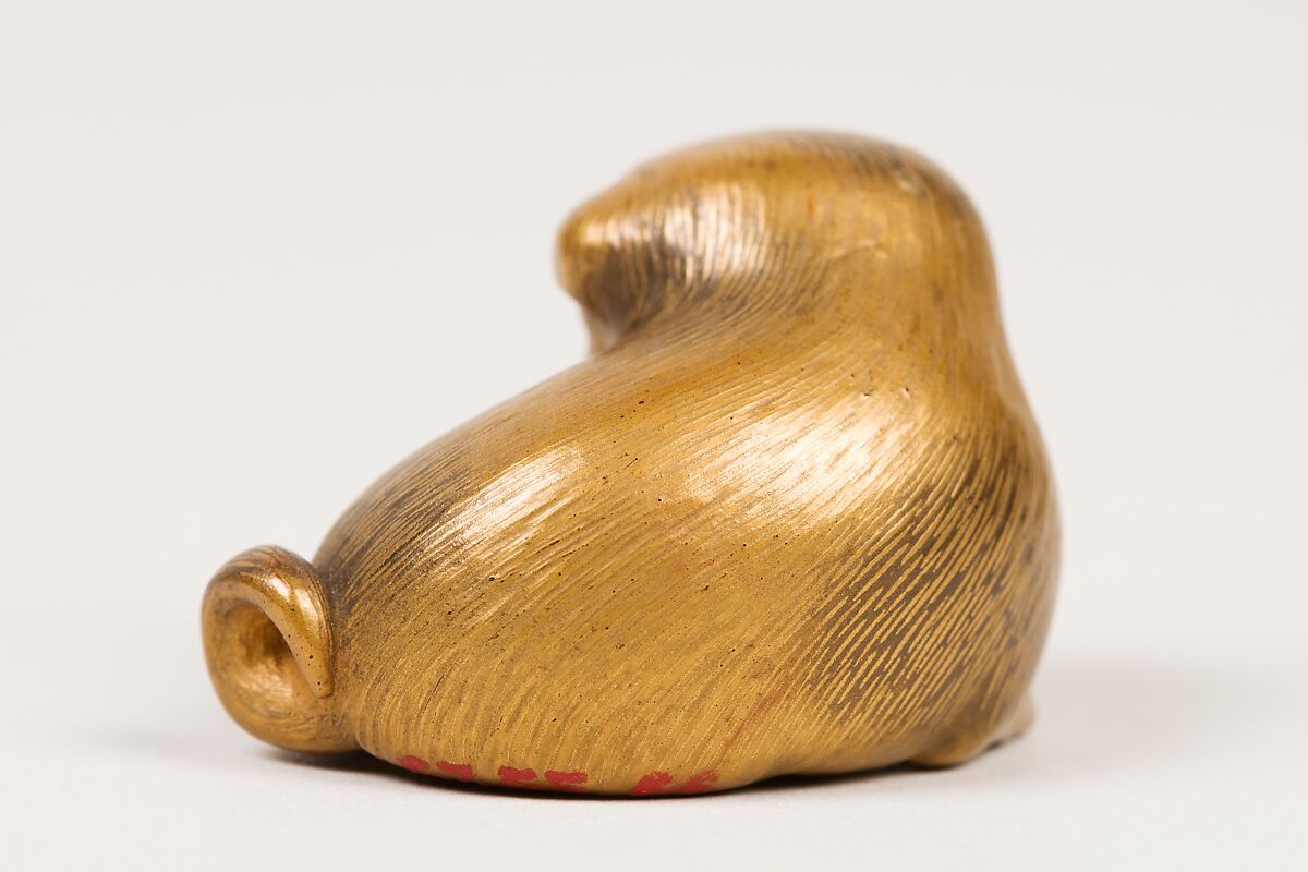 Netsuke of Seated Puppy with Short Curled Tail, Norizane (Japanese), Wood, gold lacquer mottled with black; black lacquer eyes, Japan
