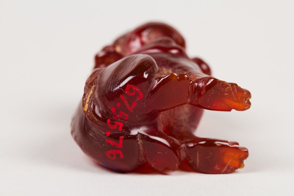 Netsuke of Seated Dog (one of a pair), Amber, Japan