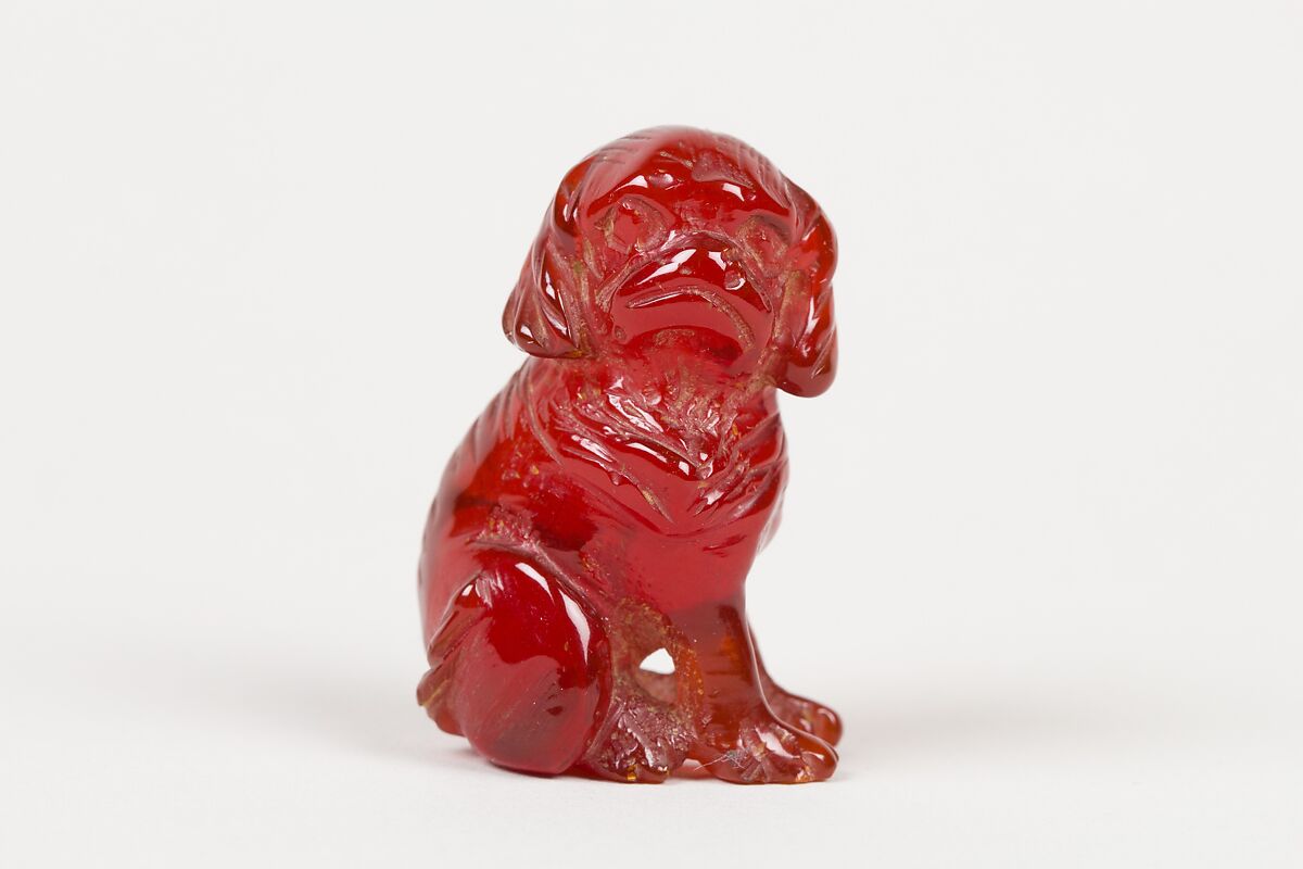 Netsuke of Seated Dog (one of a pair), Amber, Japan 