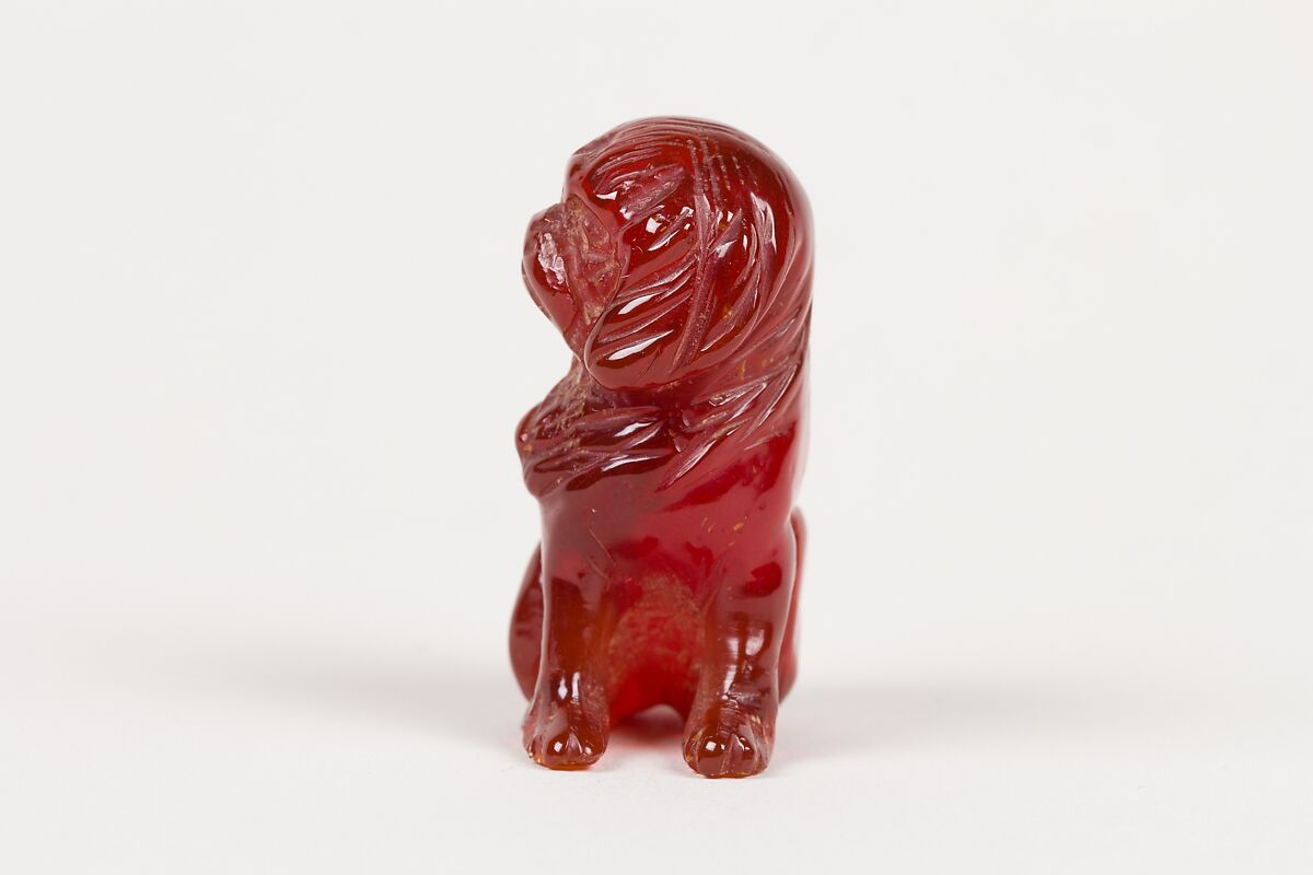 Netsuke of Seated Dog (one of a pair), Amber, Japan
