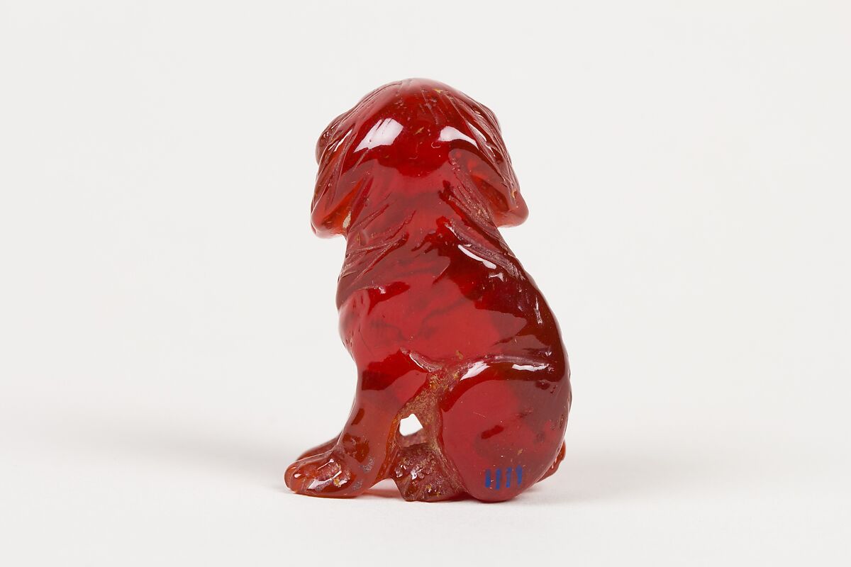 Netsuke of Seated Dog (one of a pair), Amber, Japan