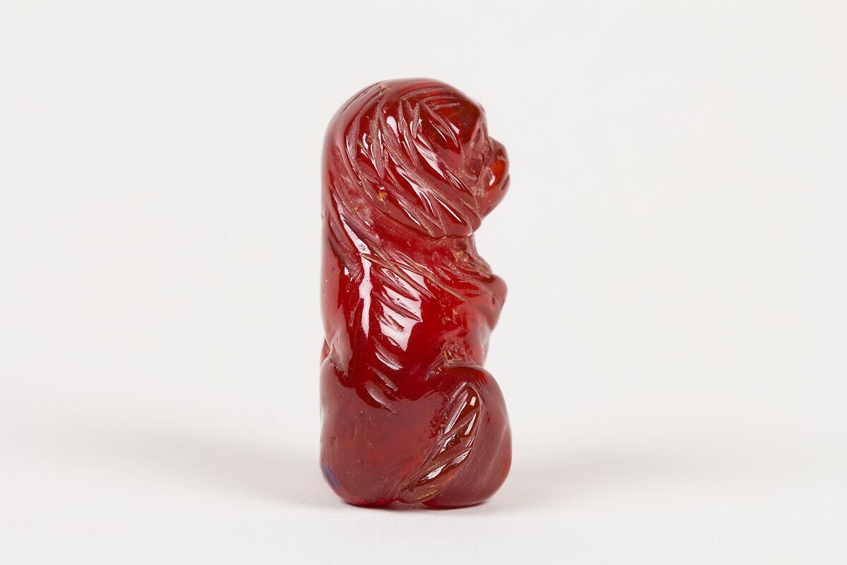 Netsuke of Seated Dog (one of a pair), Amber, Japan
