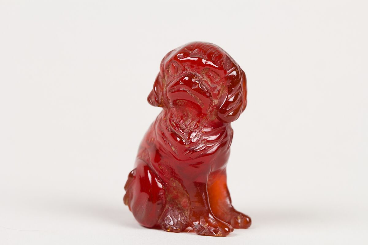 Netsuke of Seated Dog (one of a pair), Amber, Japan