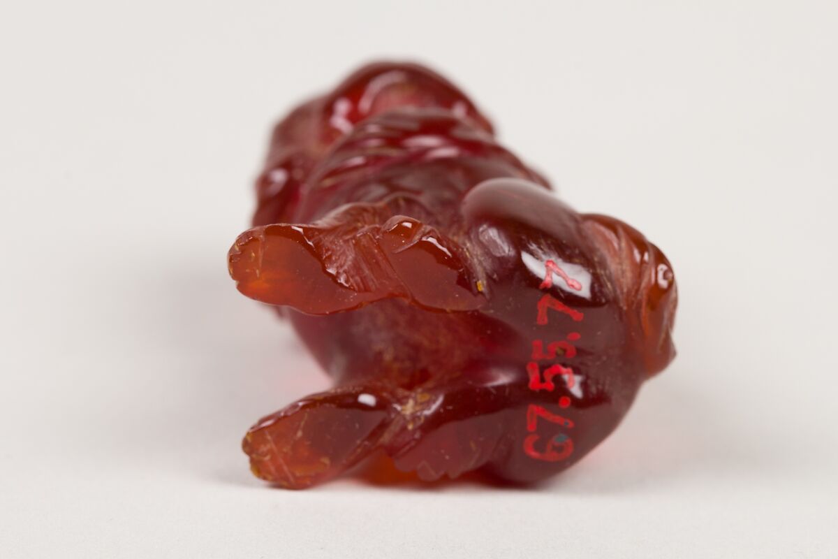 Netsuke of Seated Dog (one of a pair), Amber, Japan