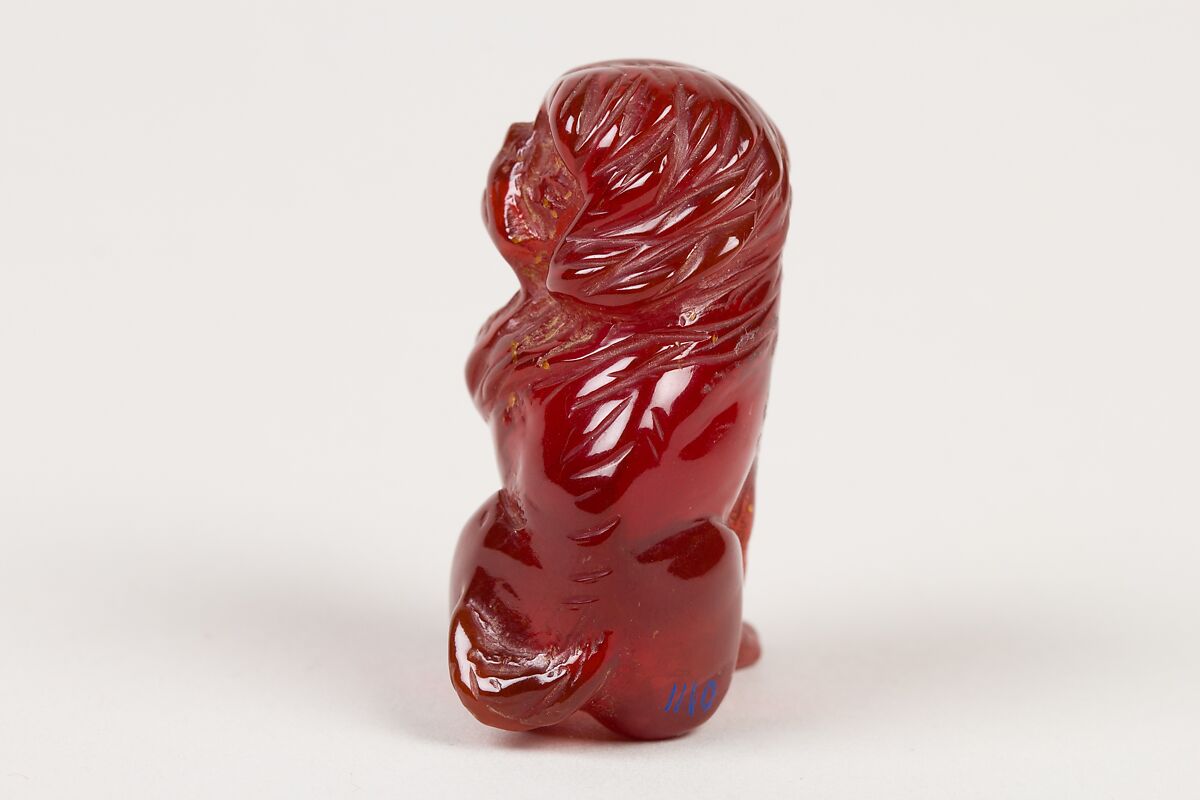 Netsuke of Seated Dog (one of a pair), Amber, Japan