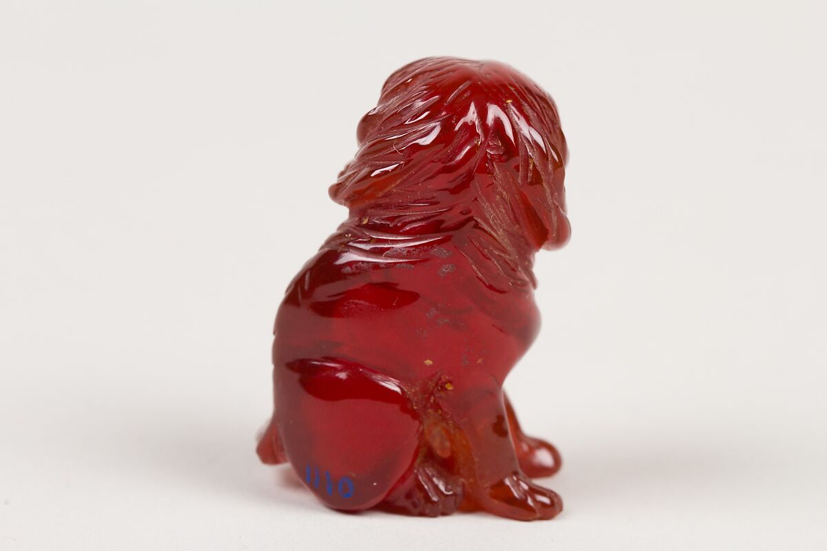 Netsuke of Seated Dog (one of a pair), Amber, Japan