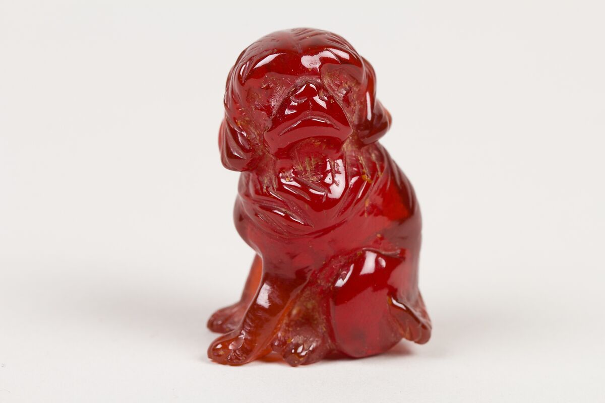 Netsuke of Seated Dog (one of a pair), Amber, Japan